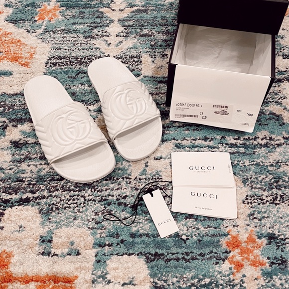Gucci Shoes - Gucci matelasse rubber GG white pool slides sandal